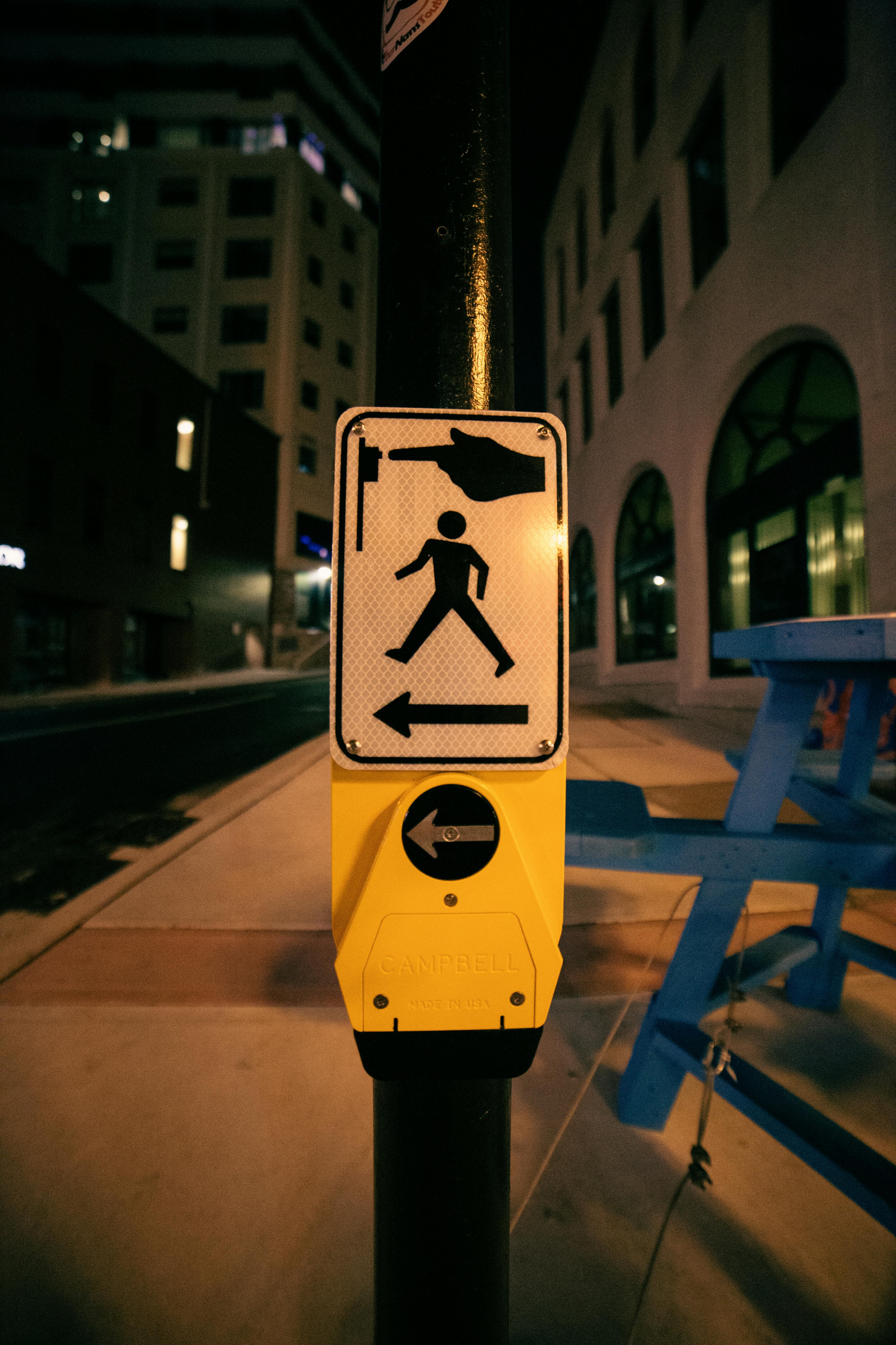 sign for pedestrians on post on roadside