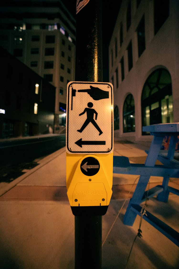 Sign For Pedestrians On Post On Roadside