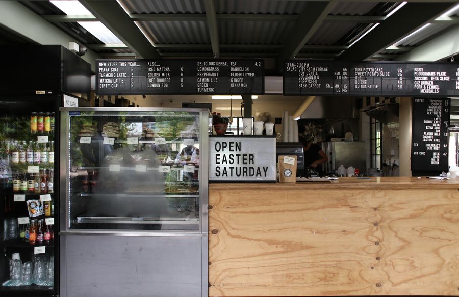 The counter and menu boards inside a small independent cafe