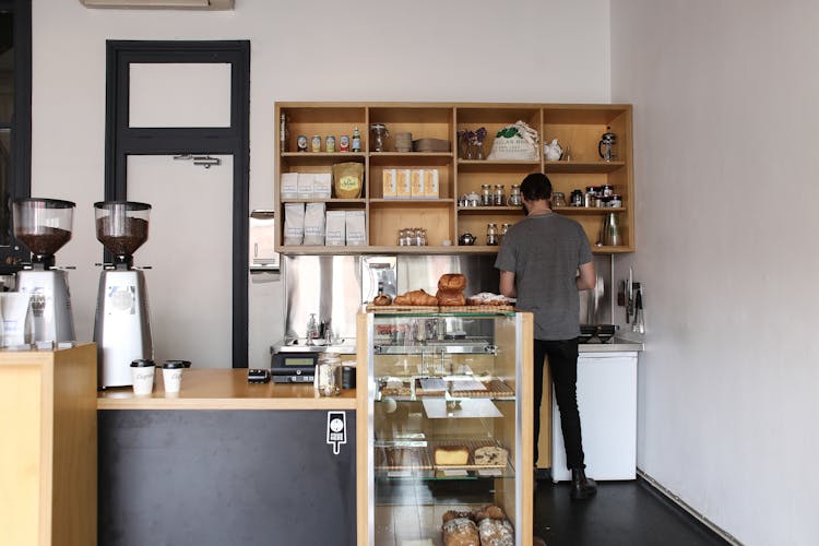 Barista Working In Cafe 