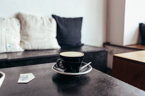 Free Cup of Coffee on a Coffee Table Stock Photo
