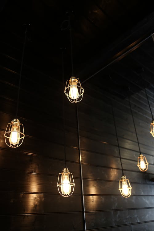 Hanging Bulb Lights Near Wooden Wall