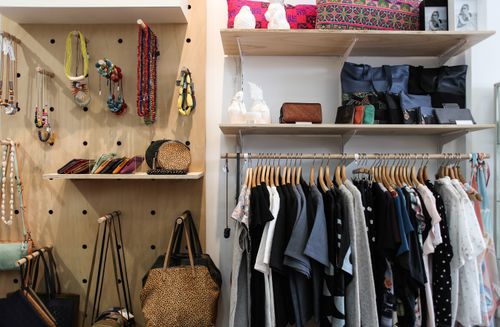 Free Neatly arranged clothing and accessories in a stylish wardrobe setup. Stock Photo
