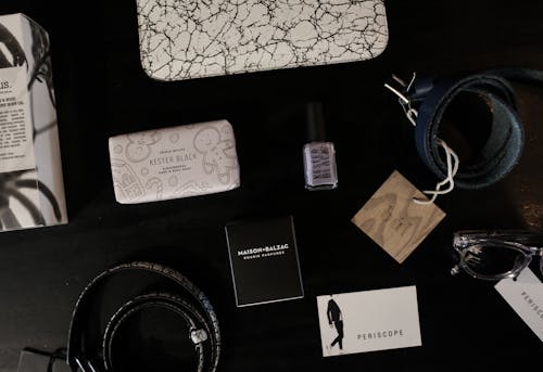 Free Woman's Accessories on Dark Colored Table Top Stock Photo