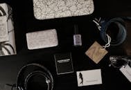 Woman's Accessories on Dark Colored Table Top