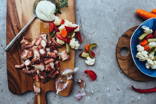 Meat and Vegetables on a Cutting Board