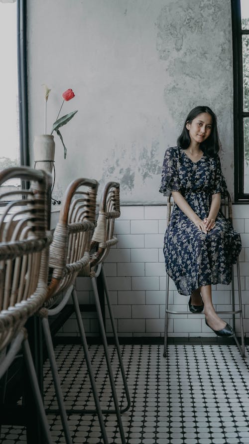 Free Woman Sitting on a High Chair in a Cafe  Stock Photo