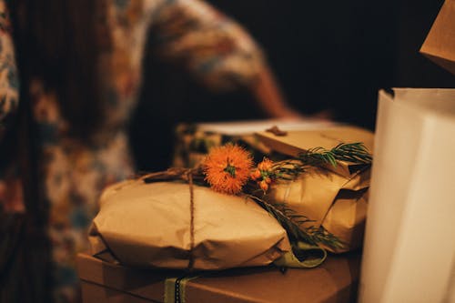 Orange Flower on Package Wrapped with Brown Paper