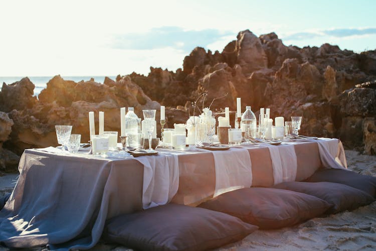 Reception Table Among Rocks On Beach