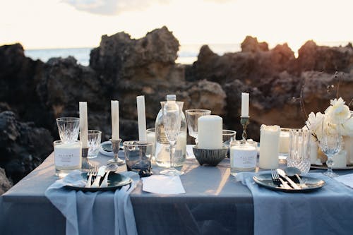 Table Setting with White Pillar Candles on Table