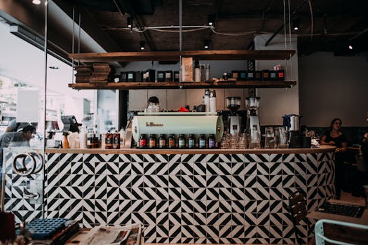 Stylish cafe interior featuring a patterned counter and modern decor, ideal for coffee enthusiasts.