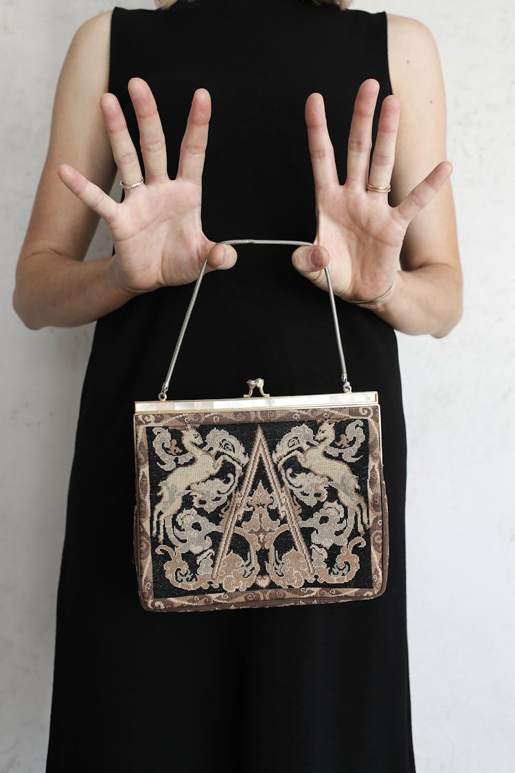 Woman Holding A Vintage Purse