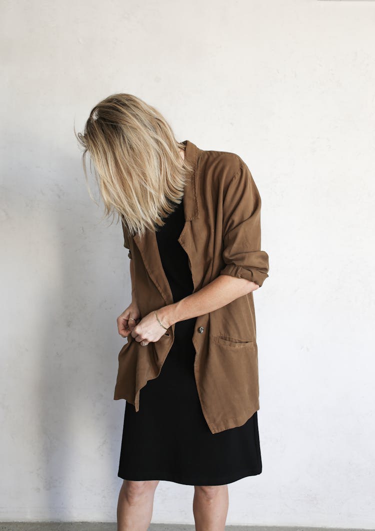 Woman Fixing Her Pocket In Her Jacket 