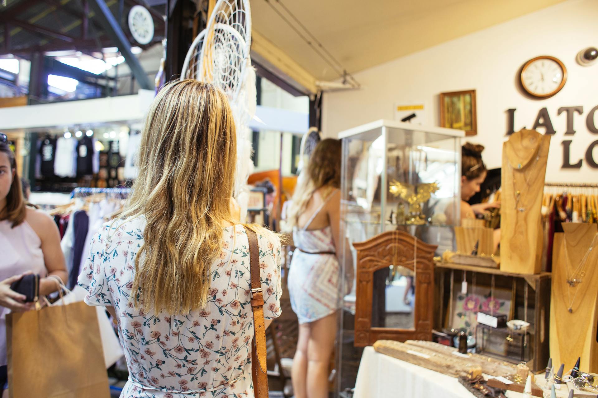 Customers explore unique items in a stylish boutique shop, capturing the essence of modern shopping.