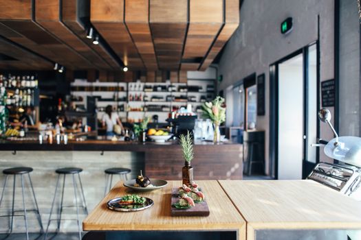 A contemporary restaurant showcasing fresh gourmet dishes on a stylish wooden table.