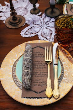 Charming table setting featuring vintage cutlery, a decorative doily, and elegant tableware. Perfect for special occasions.