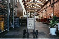 Signage on Gray Steel Push Cart