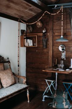 Warm and rustic interior design with wood furniture and ethnic decor accents.
