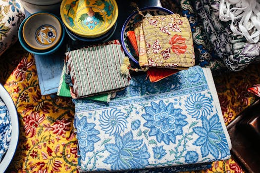 Brightly colored textiles and patterned bowls create an artistic display.