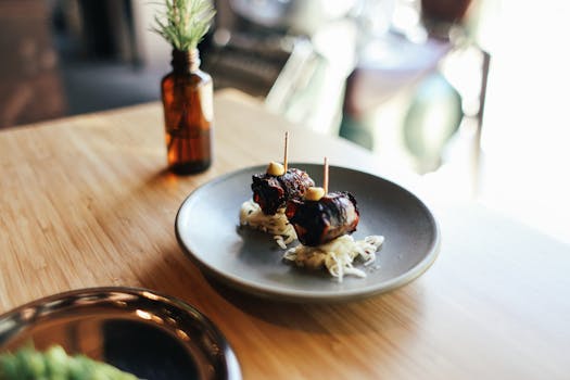 Elegant display of gourmet meat skewers with toothpicks on a ceramic plate, perfect for culinary inspiration.
