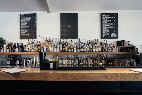 Liquor and Wine Bottles on Shelves of a Bar