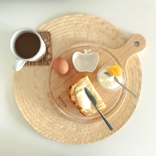 Free Bread with Butter Egg on the Side with a Cup of Coffee Stock Photo