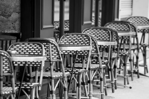 Grayscale Photo of Chairs