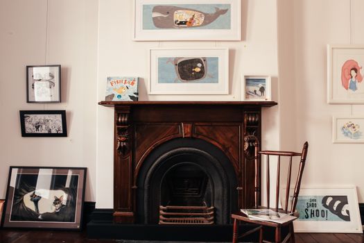 Fireplace in a Living Room with Art on Walls 