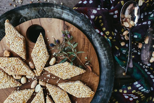 Sesame Seed Candy with Peanuts on a Wooden Tray