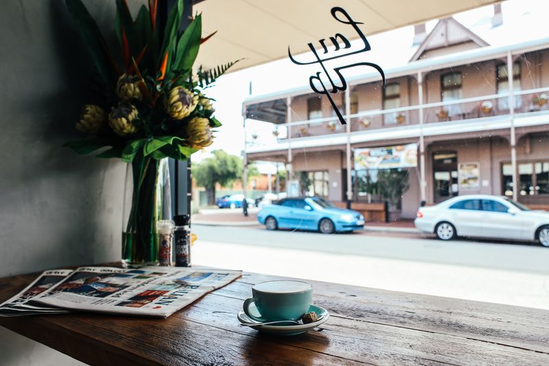 Takeaway coffee ready near the window at the Gertrude Street cafe