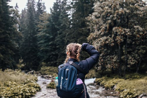 Free Woman in Black Dawn Jacket and Backpack Stock Photo