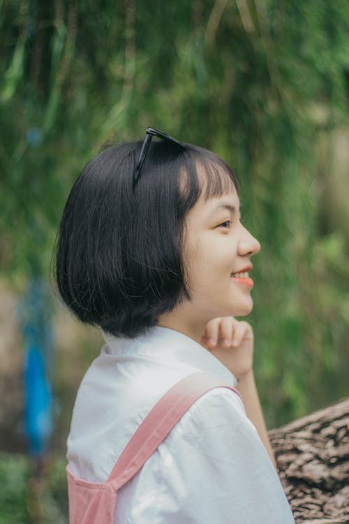 Free Side View Shot of a Happy Woman Looking Afar Stock Photo