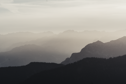 Free Misty mountain silhouette in Durach, Bavaria, Germany at twilight creating a serene atmosphere. Stock Photo