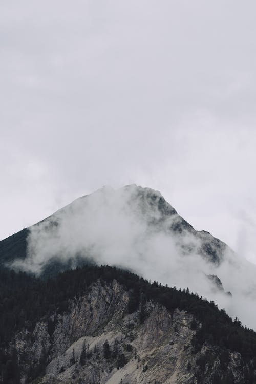 Free Silhouette of Mountain Under the Gray Sky Stock Photo