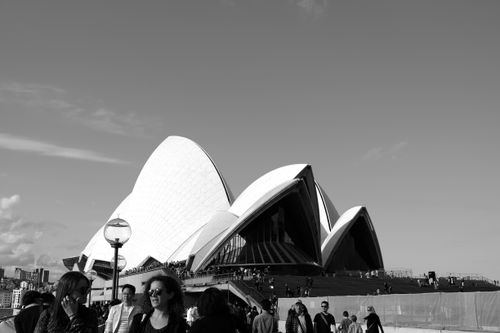 Free Black and white photo of Sydney Opera House with crowds, iconic Australian landmark. Stock Photo