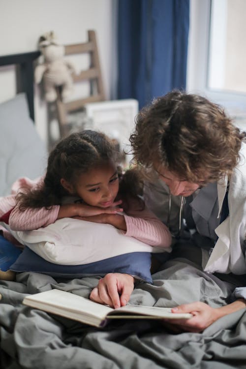 Father Reading a Book for his Daughter