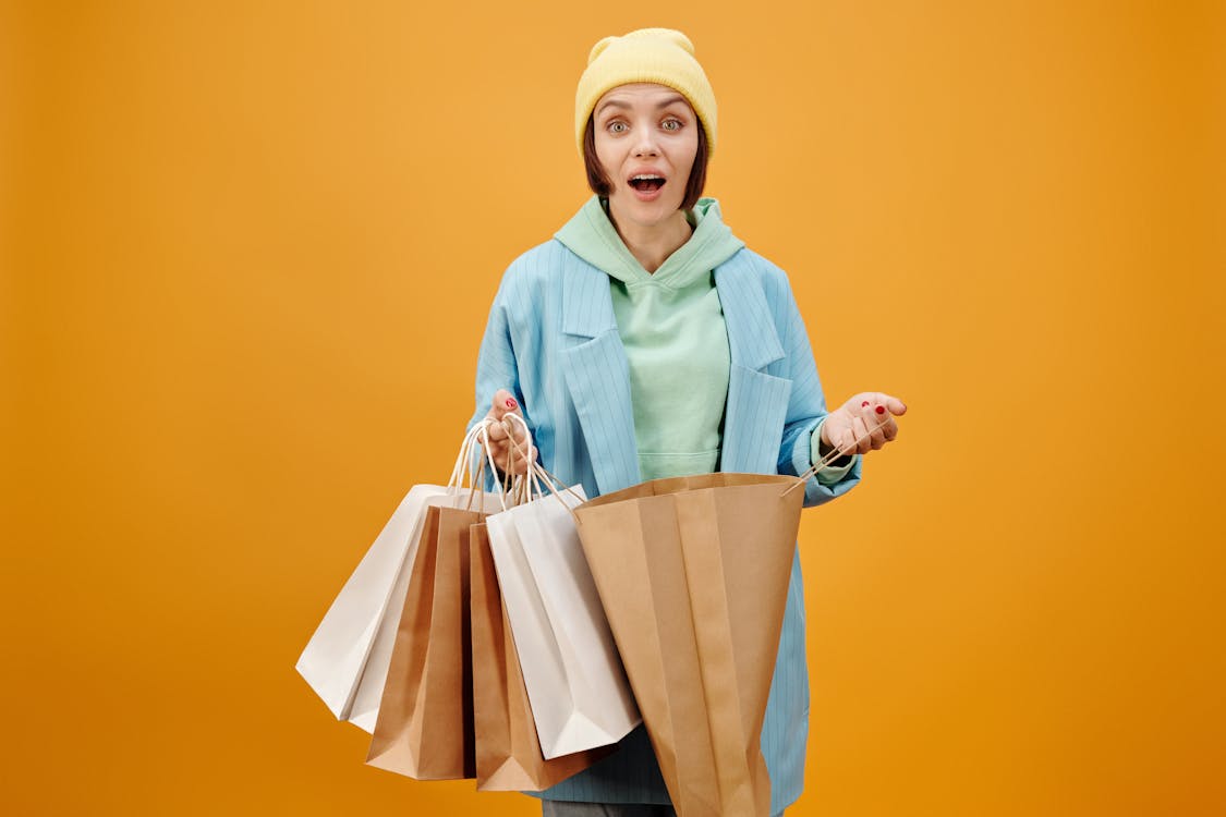 Free A Woman Opening a Paper Bag Stock Photo
