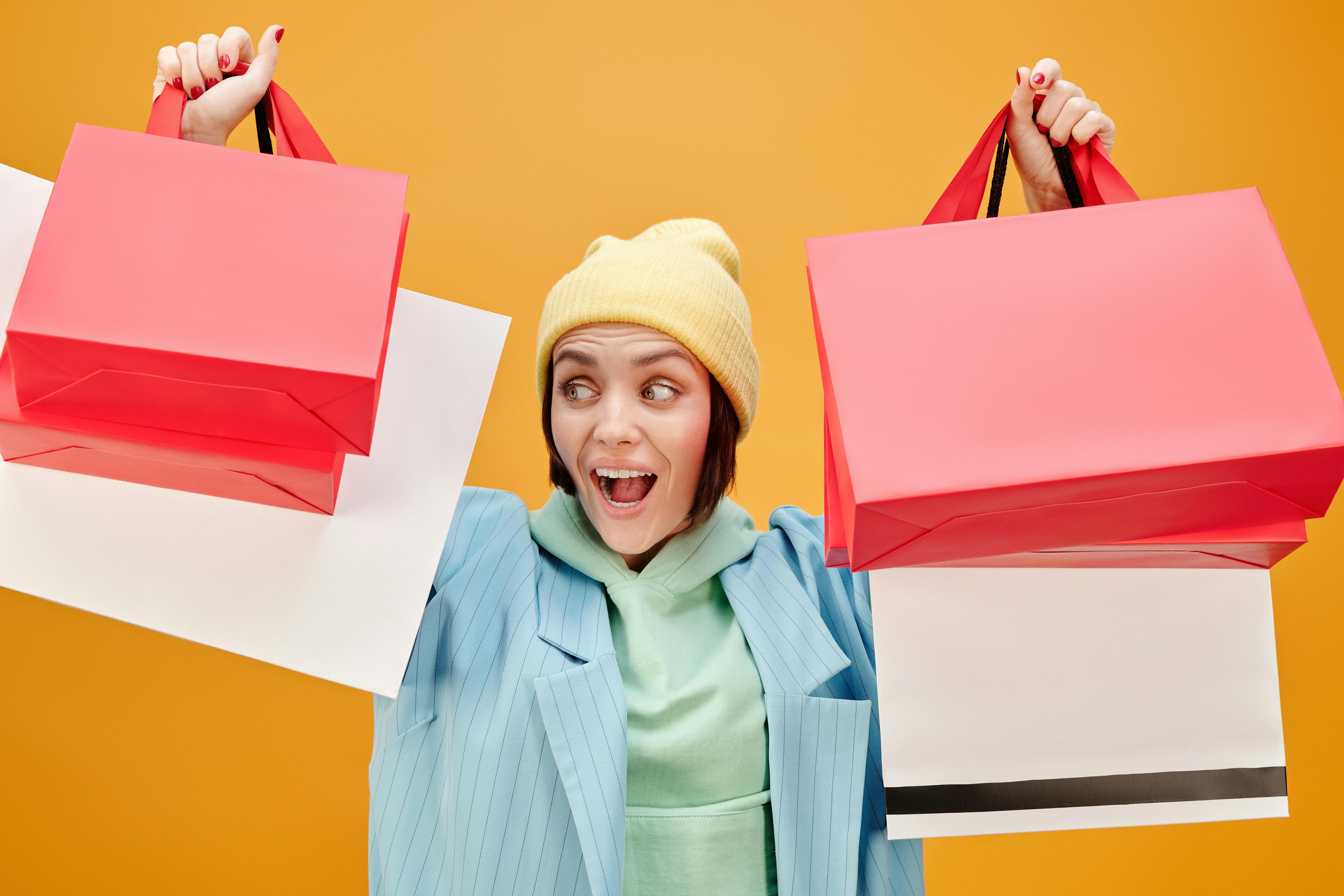 a woman holding paper bags