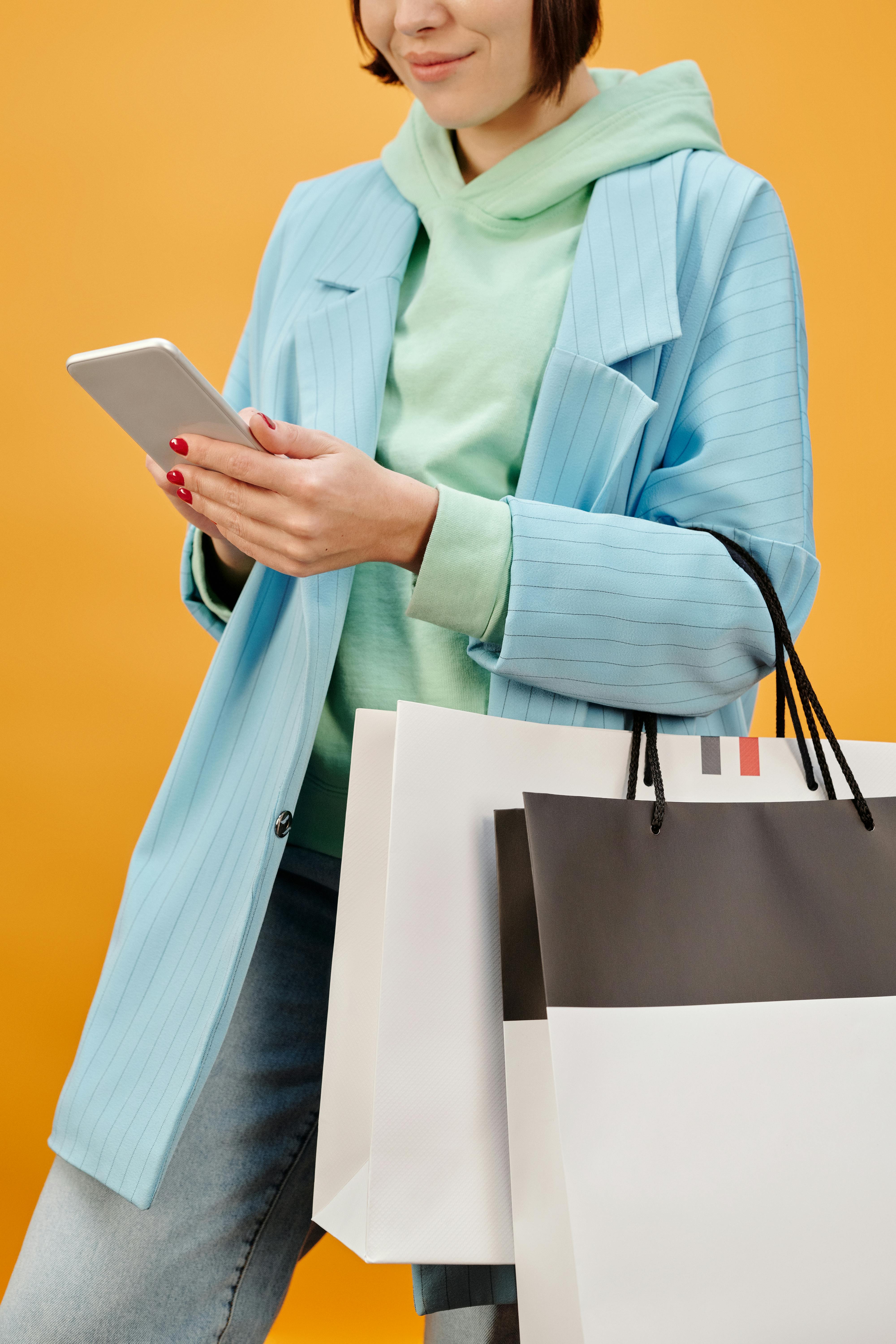 a woman holding shopping bags