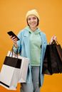 Woman in Green Dress Shirt Holding Black Smartphone