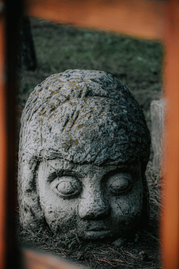 Gray Concrete Human Face Statue