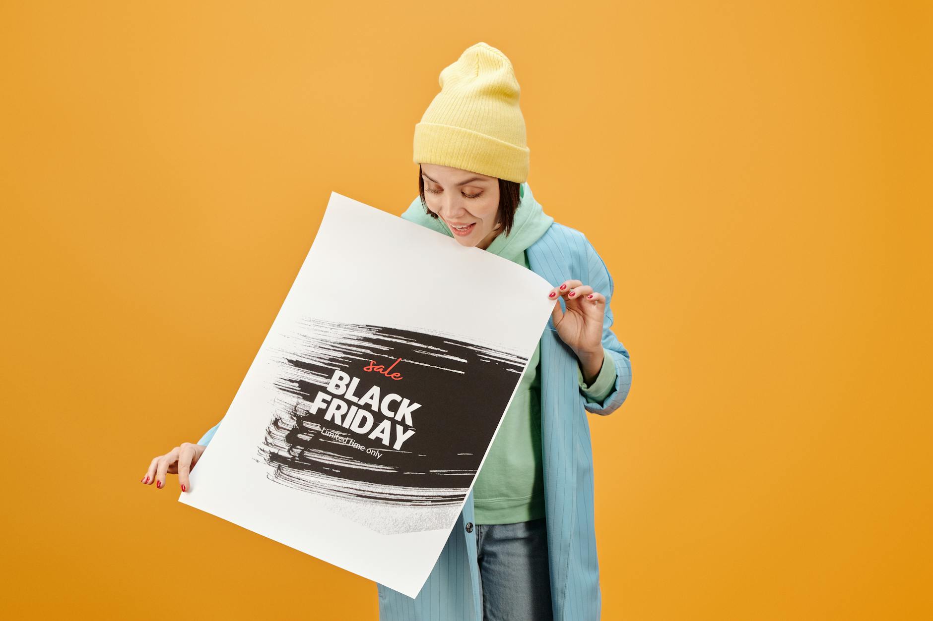 Woman Looking at the Banner she is Holding