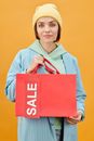 Woman in Blue Long Sleeve Shirt Holding Red Box