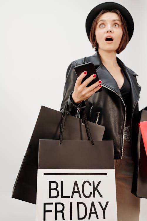 Free A Woman Holding Shopping Bags Stock Photo