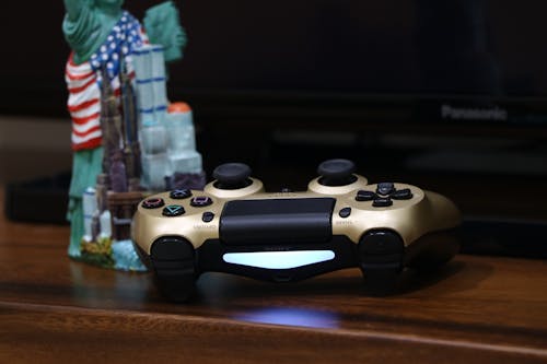 Gold and Black Game Controller