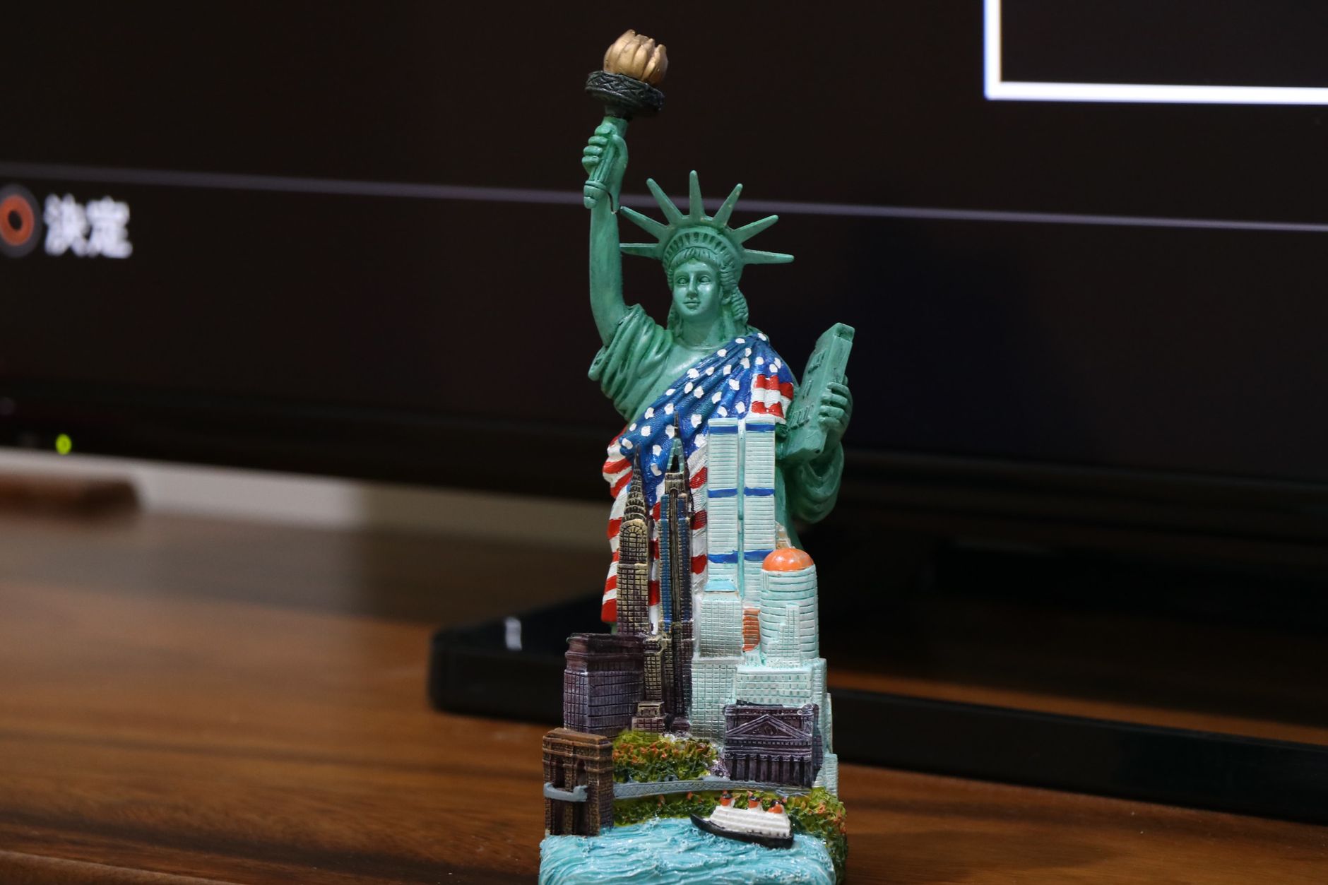 Close-up of a miniature Statue of Liberty figurine as a decorative piece.