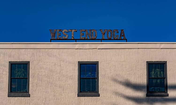 West End Yoga Sign On A Building