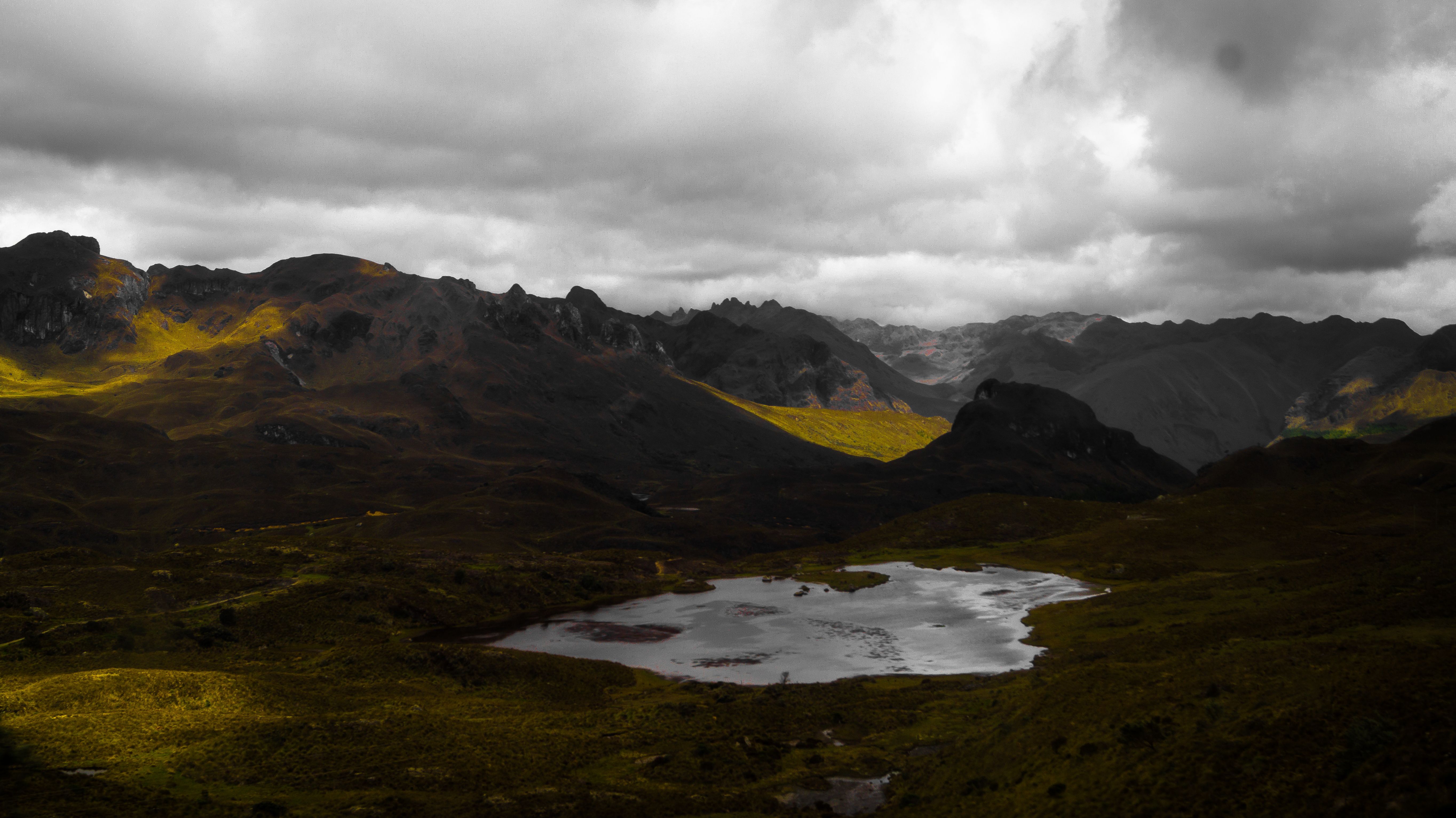 Best Private Cotopaxi Volcano Expedition Day Review: Ecuador's Most Stunning High-Altitude Adventure Review 2026 - Dramatic view of mountains and lake under cloudy skies in Cuenca, Ecuador.