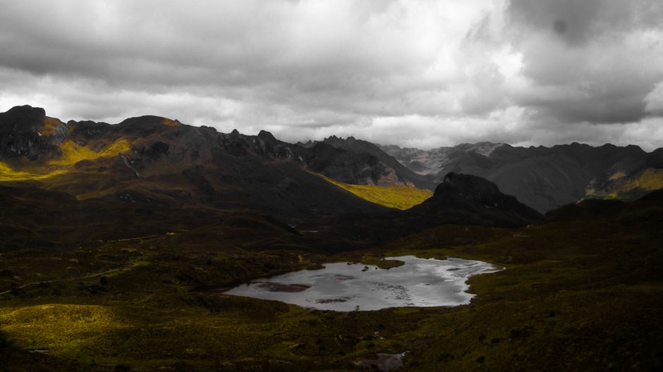Best Private Cotopaxi Volcano Expedition Day Review: Ecuador's Most Stunning High-Altitude Adventure Review 2026 - Dramatic view of mountains and lake under cloudy skies in Cuenca, Ecuador.