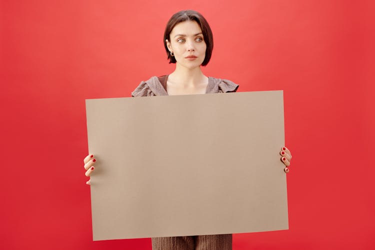 Woman Holding A Board